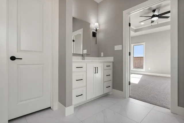 a spacious bathroom with a shower and a sink