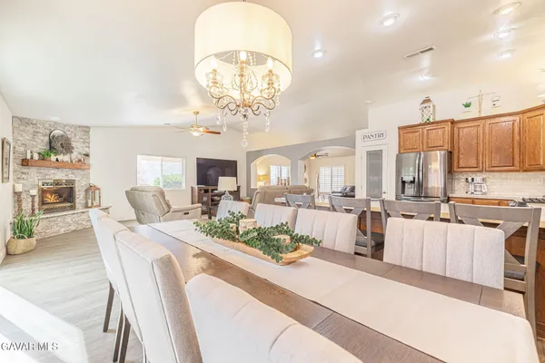 a kitchen with stainless steel appliances granite countertop a stove sink and cabinets