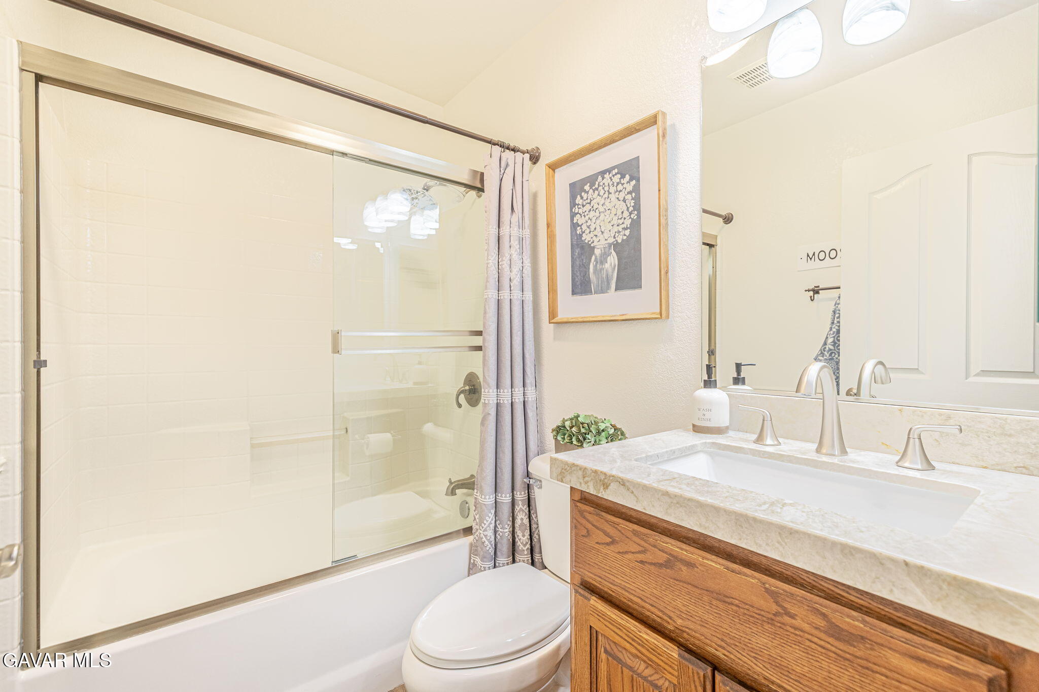 19812 Breeze Place Tehachapi, CA 93561 - Photo 30 of 59 a bathroom with a granite countertop sink toilet and shower