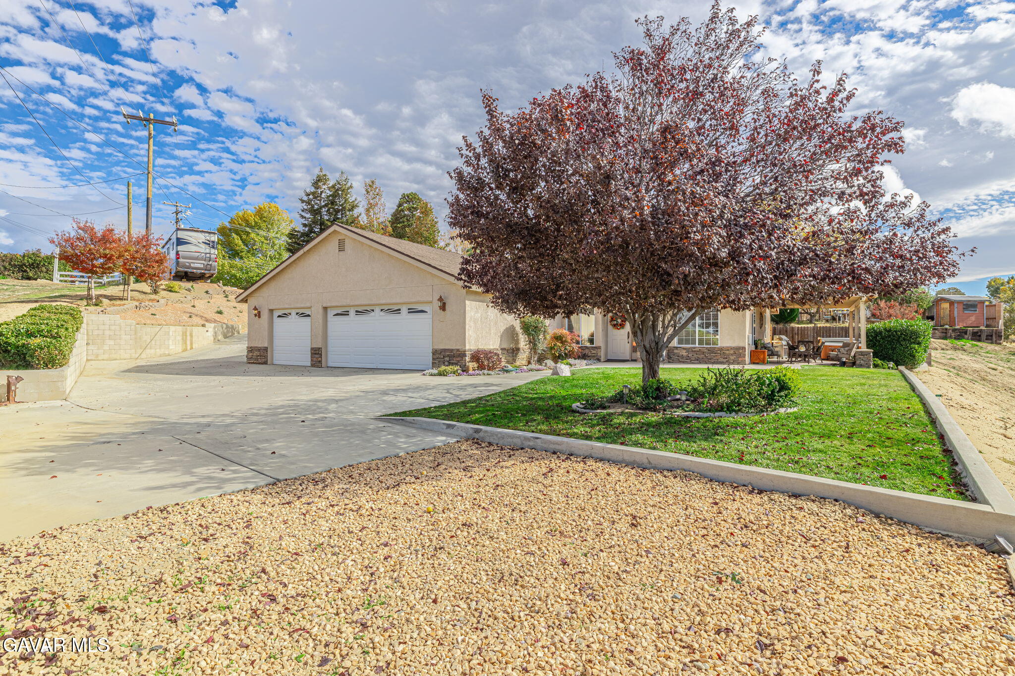 19812 Breeze Place Tehachapi, CA 93561 - Photo 3 of 59 a front view of a house with a yard and potted plants