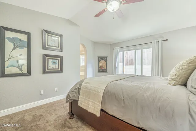 a view of a patio with table and chairs and potted plants