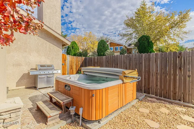 a view of a terrace with a table and chairs