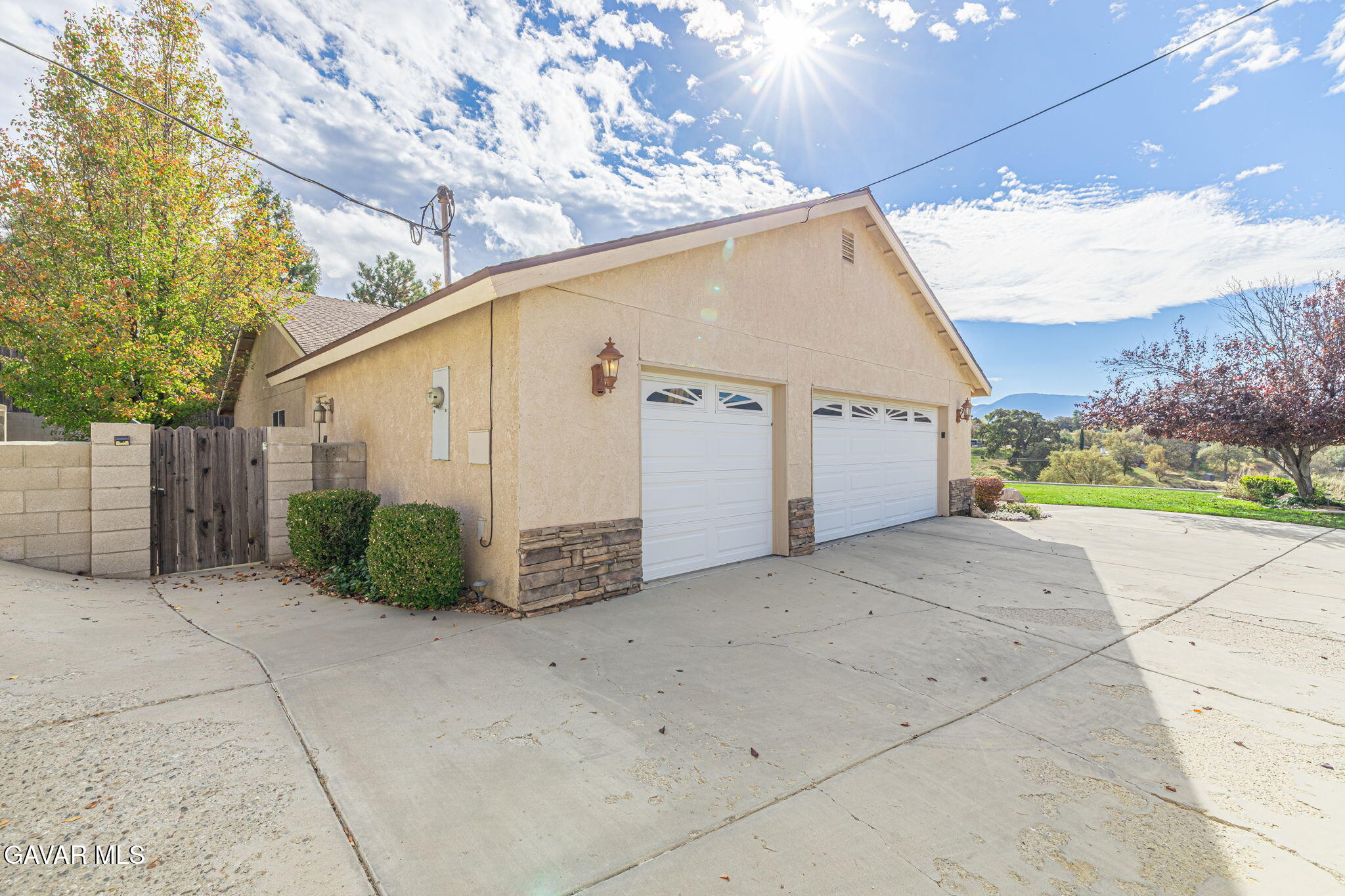 19812 Breeze Place Tehachapi, CA 93561 - Photo 5 of 59 a view of a house with a yard and garage