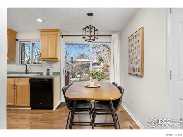 a kitchen with kitchen island a counter top space stainless steel appliances and cabinets