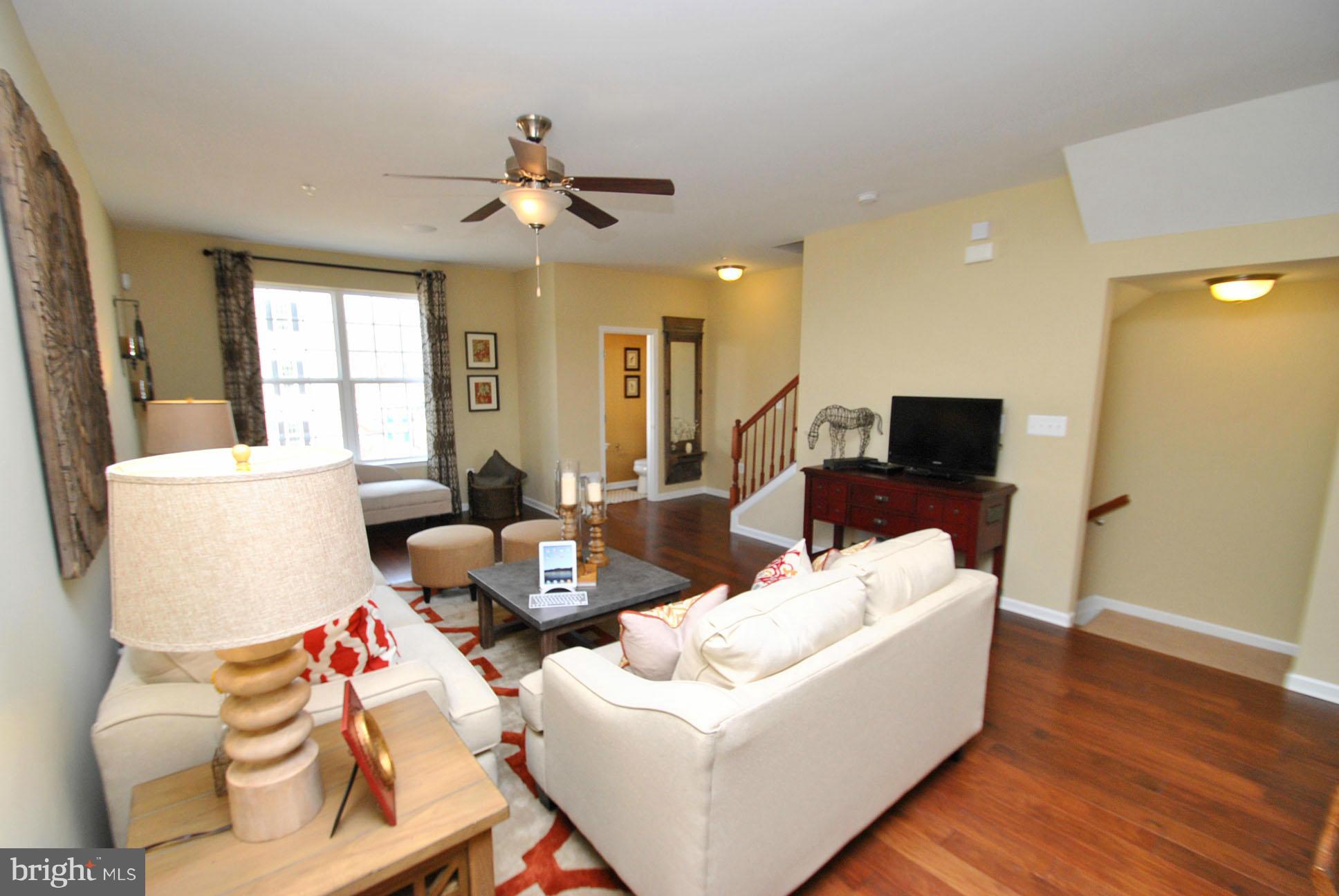 937 Ramble Run Road Middle River, MD 21220 - Photo 11 of 21 a living room with furniture and a flat screen tv