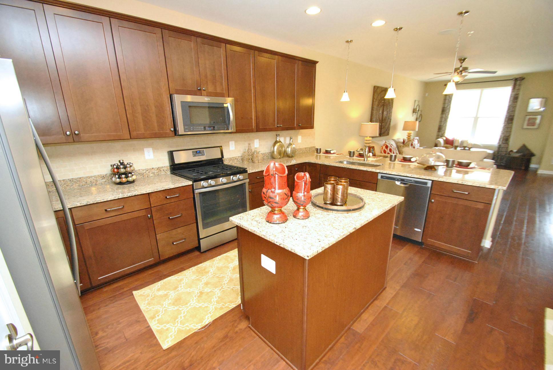 937 Ramble Run Road Middle River, MD 21220 - Photo 9 of 21 a kitchen with a sink stove and cabinets