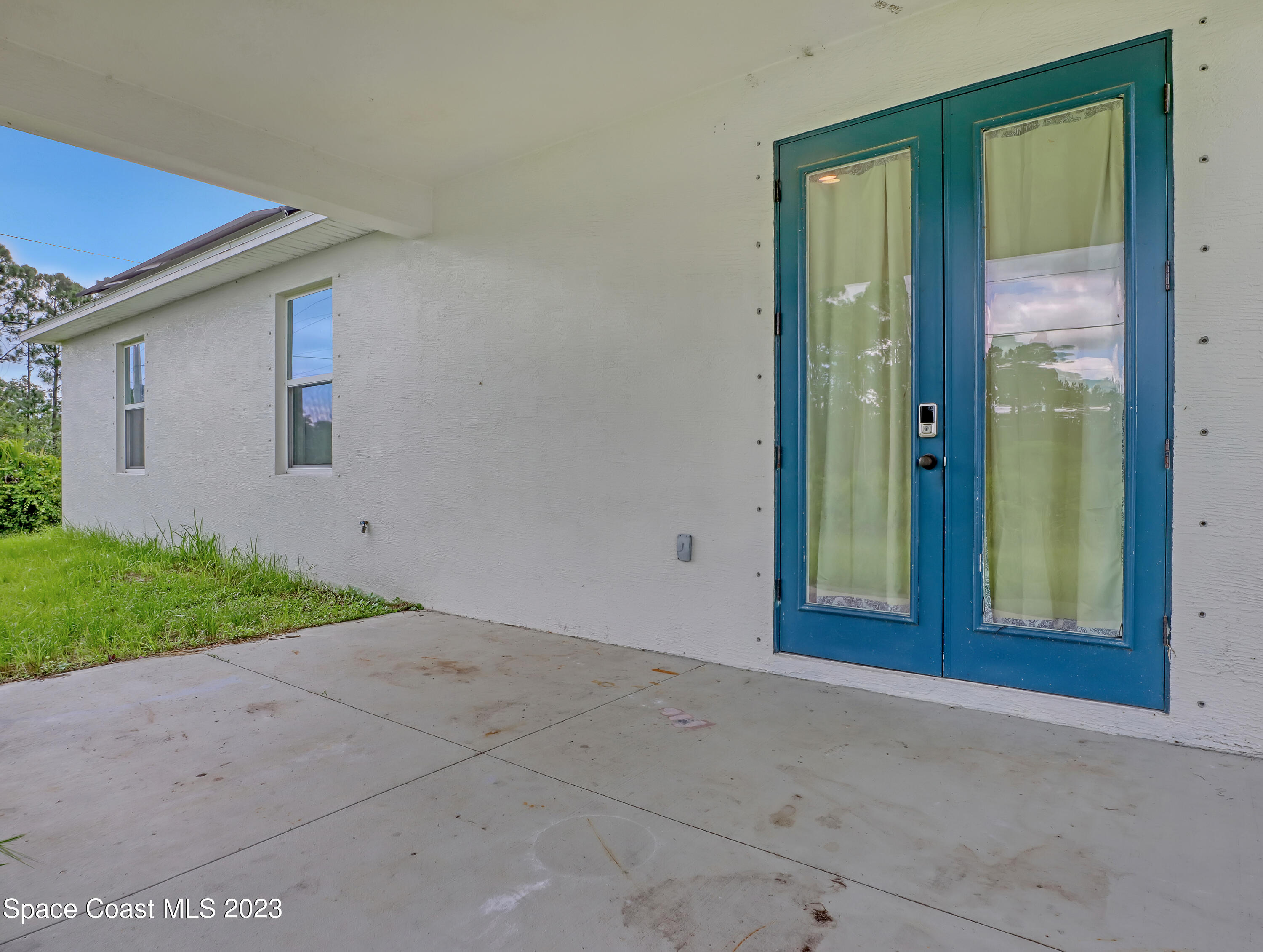 1310 Gaucho Road Southwest Palm Bay, FL 32908 - Photo 28 of 32 front view of a house with a yard
