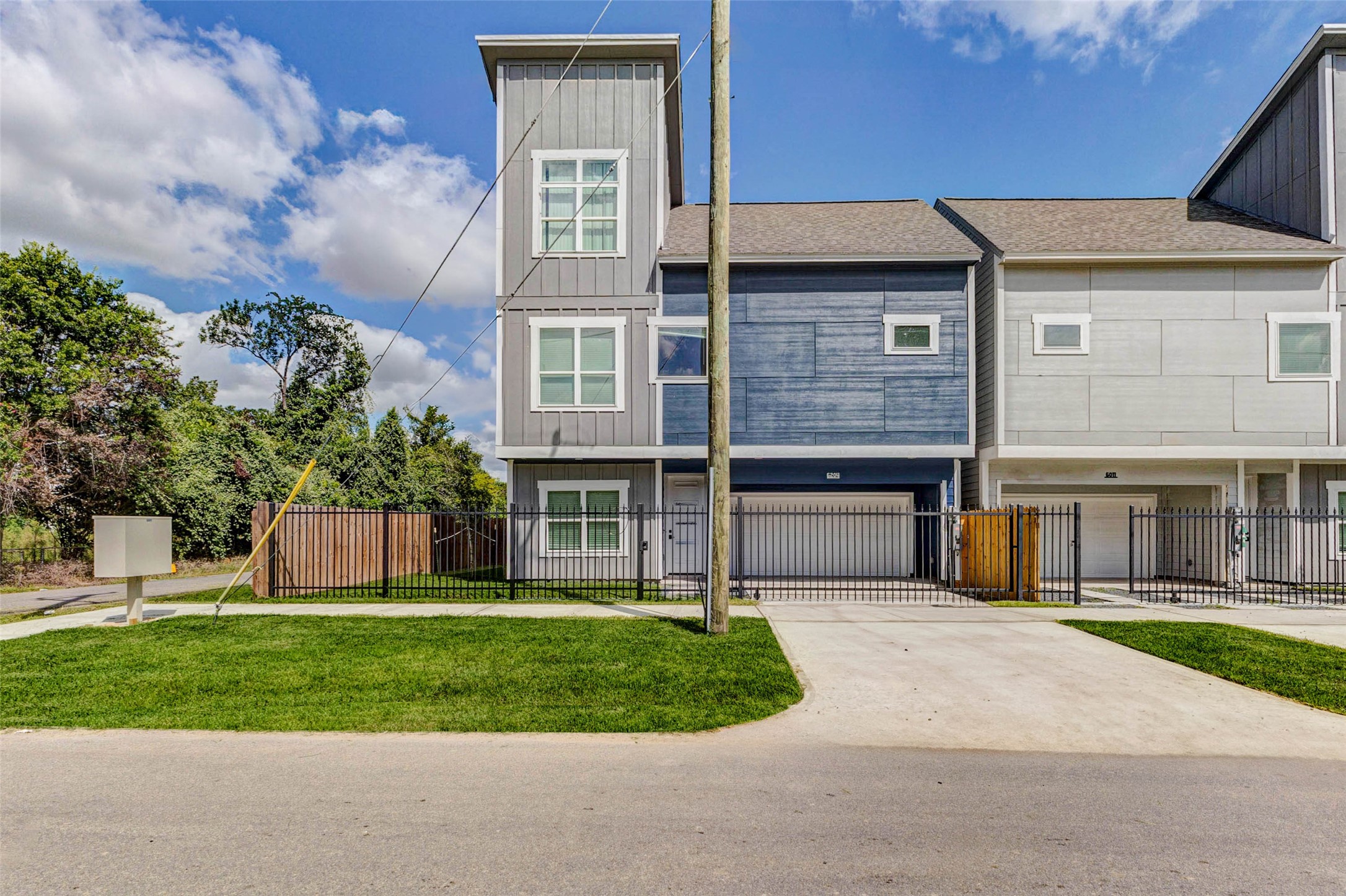 6017 Beall Street Houston, TX 77091 - Photo 33 of 33 Clean, contemporary, and move-in ready. This newly built end-unit townhome features a sleek facade, a double garage, and a fenced yard perfect for those who value modern design and security.