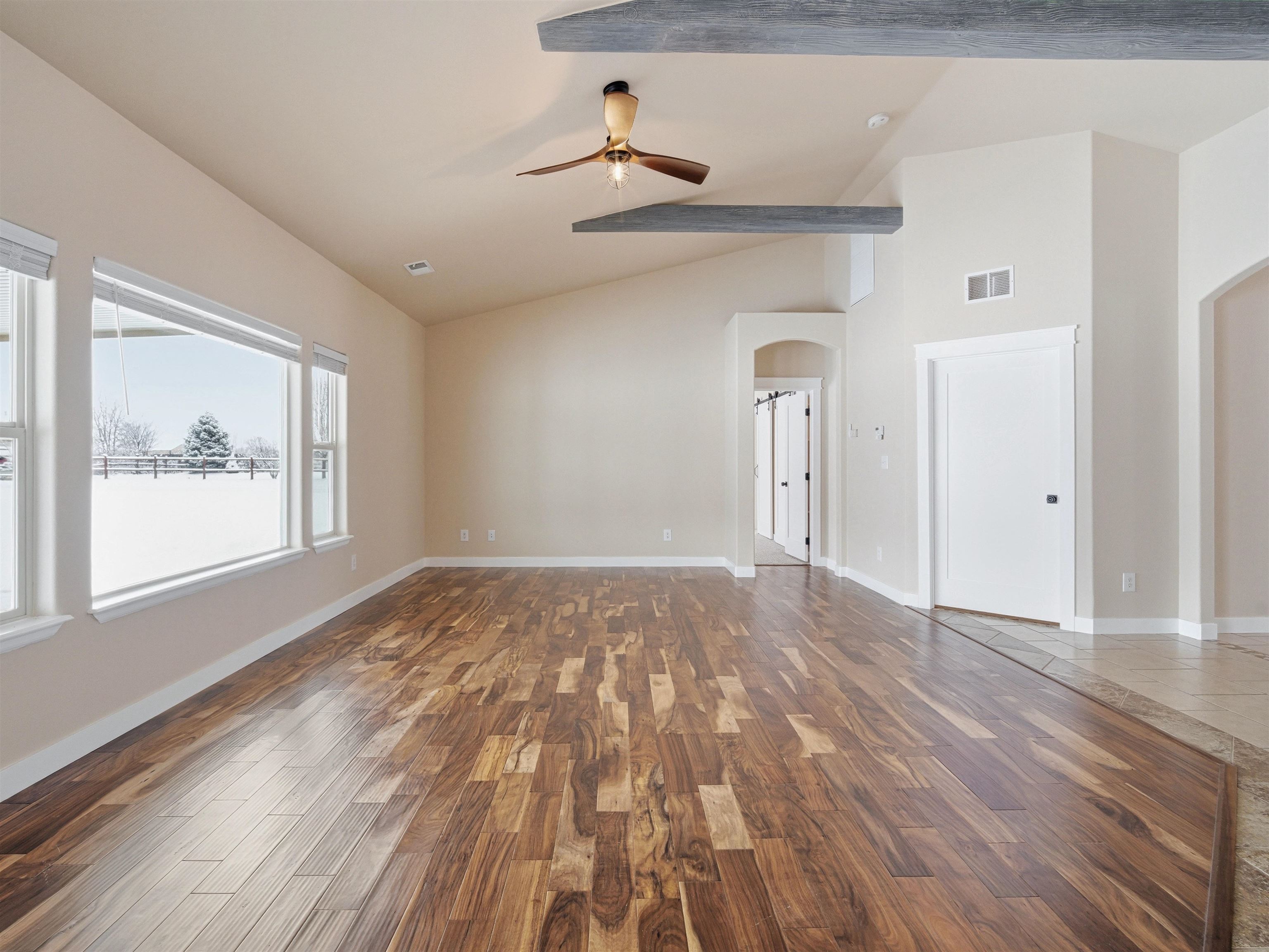 1850 Golden Ranch Road Fruita, CO 81521 - Photo 14 of 39 a view of empty room with wooden floor and fan