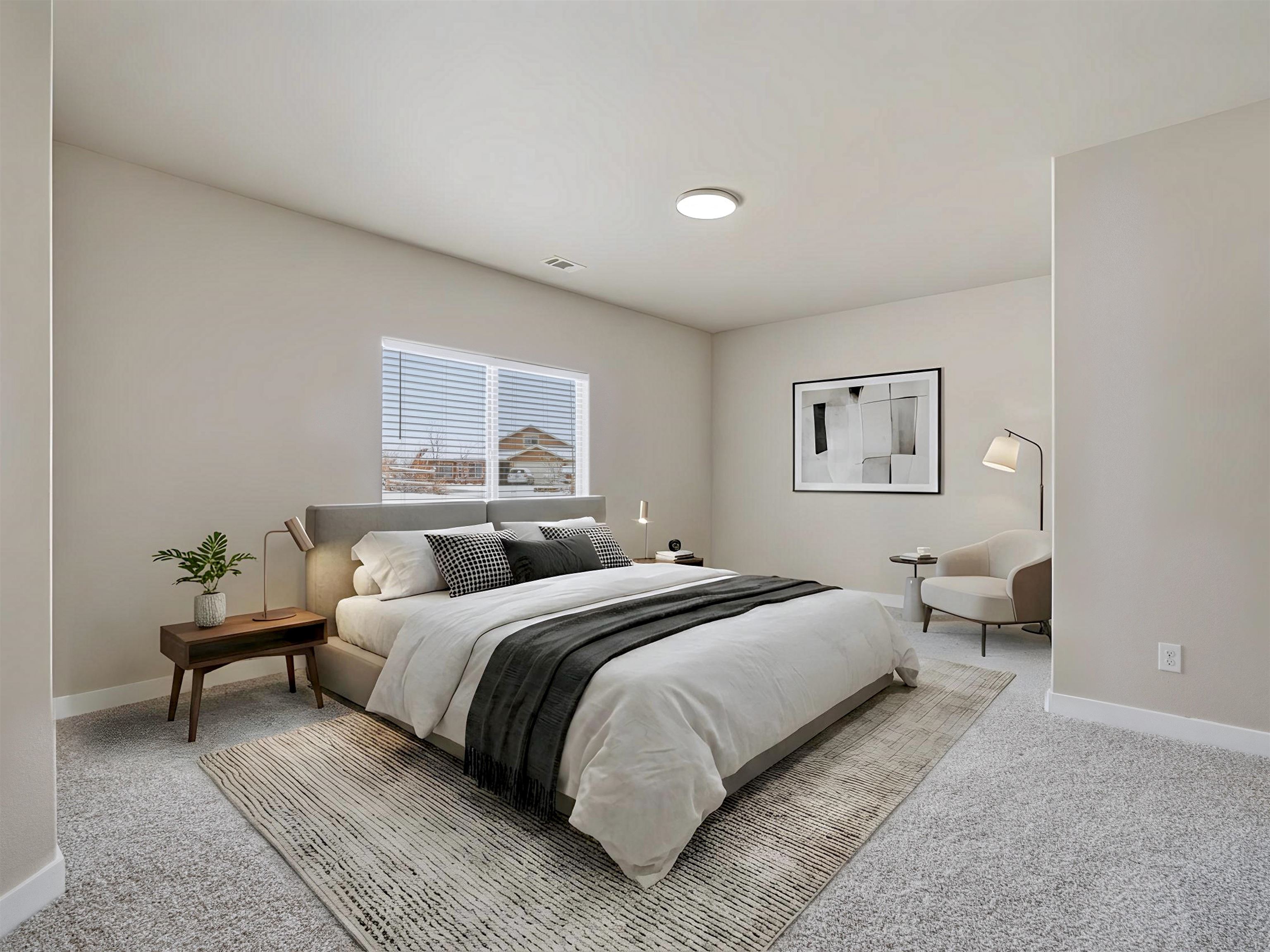 1850 Golden Ranch Road Fruita, CO 81521 - Photo 16 of 39 a bedroom with a bed and a couch