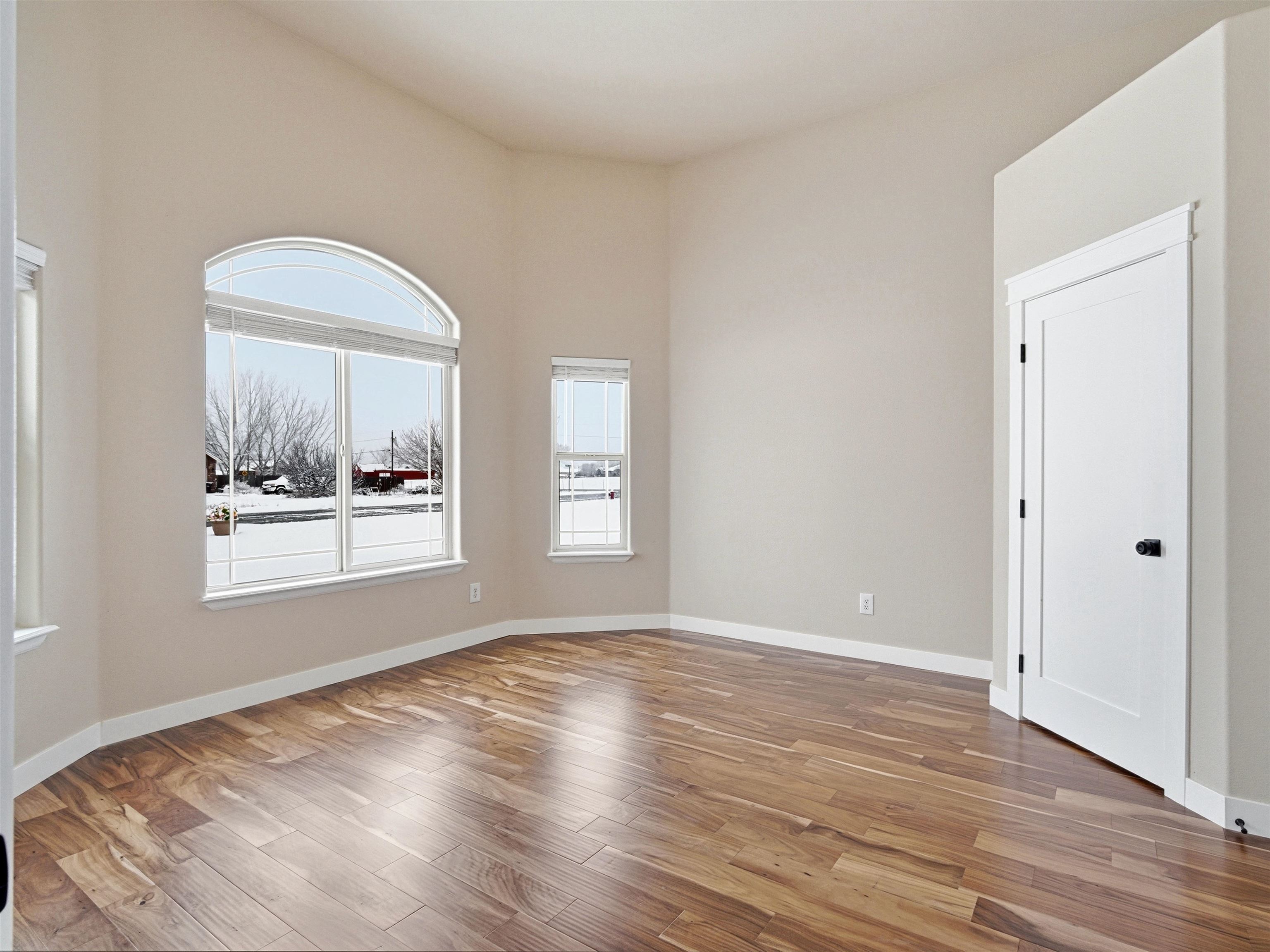 1850 Golden Ranch Road Fruita, CO 81521 - Photo 24 of 39 a view of a big room with wooden floor and a window