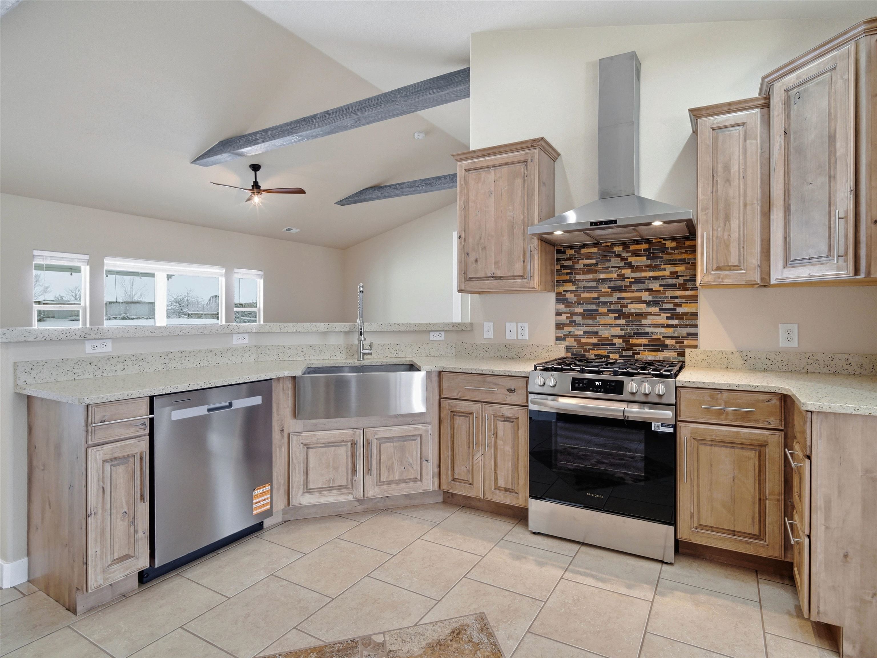 1850 Golden Ranch Road Fruita, CO 81521 - Photo 4 of 39 a kitchen with stainless steel appliances granite countertop a stove sink and cabinets