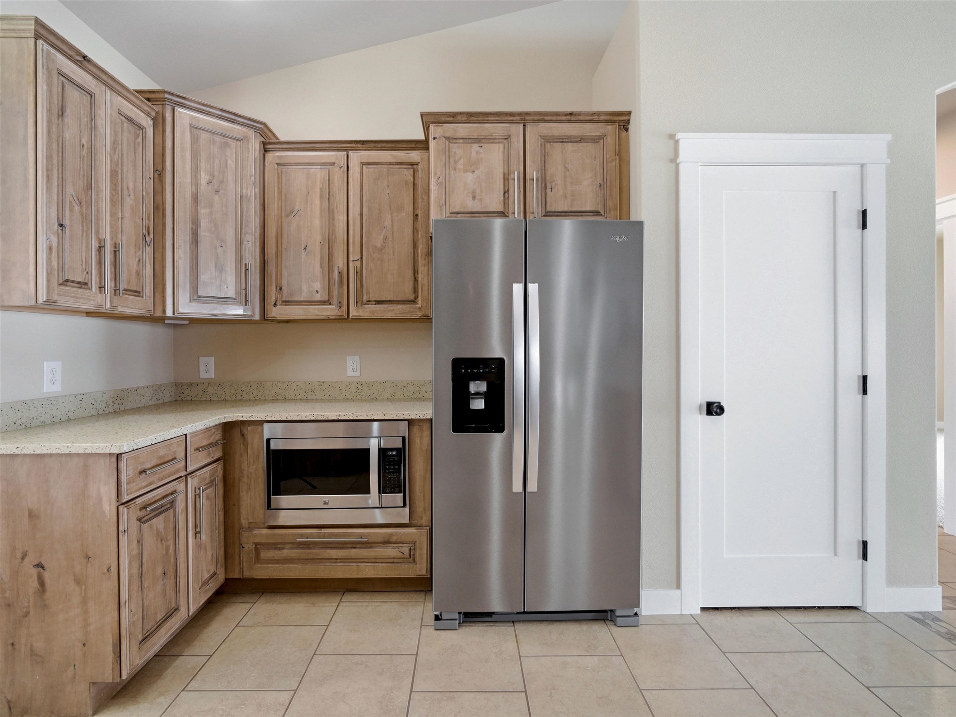 1850 Golden Ranch Road Fruita, CO 81521 - Photo 5 of 39 a kitchen with granite countertop a refrigerator and a sink
