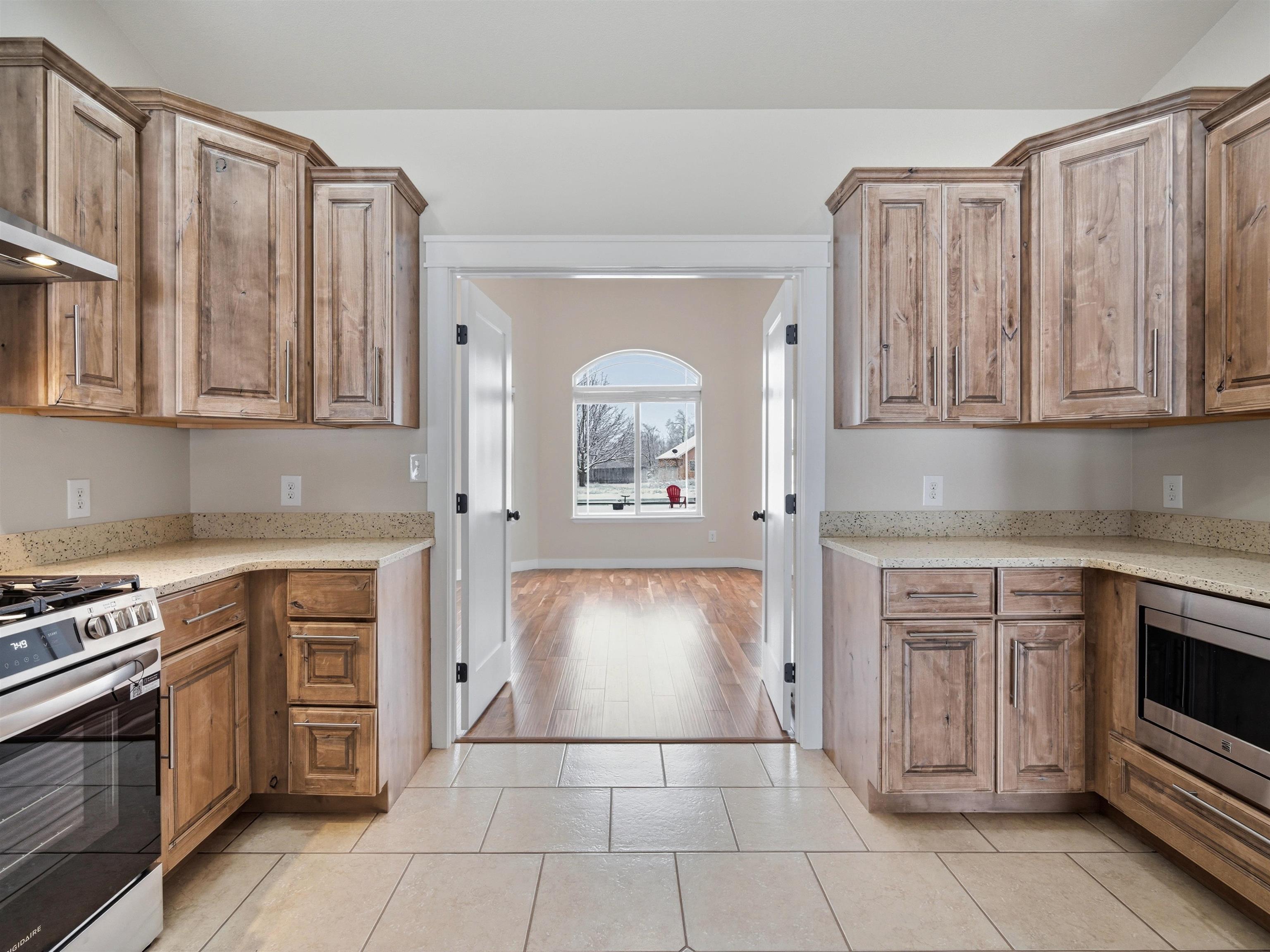 1850 Golden Ranch Road Fruita, CO 81521 - Photo 6 of 39 a kitchen with stainless steel appliances granite countertop a stove and a sink