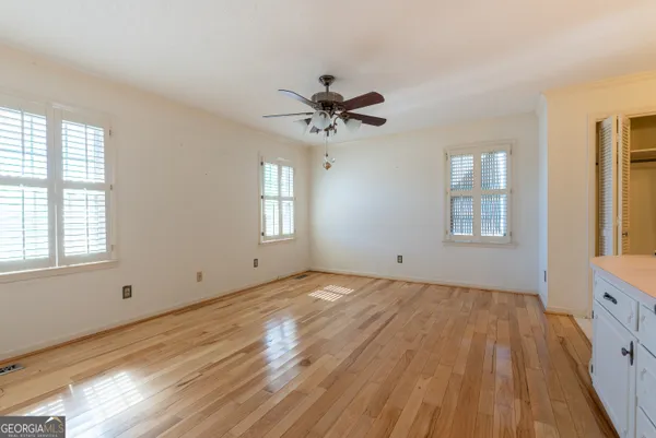 a view of an empty room with a window