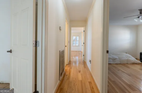 a view of a bedroom from a hallway