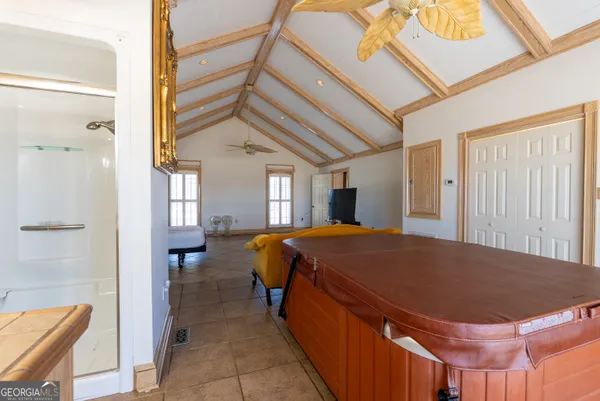 a living room with a bed and furniture