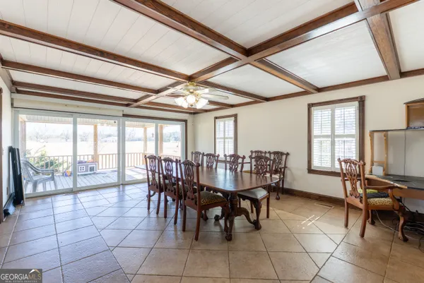 a view of a dining room with furniture window and outside view