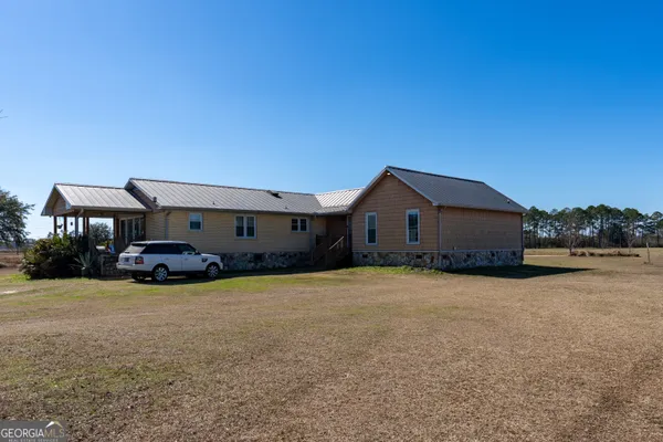 a front view of a house with yard