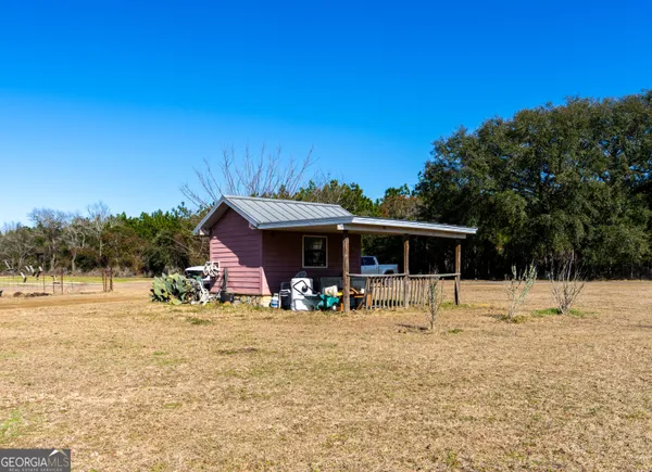 a view of a lake with a house in the background