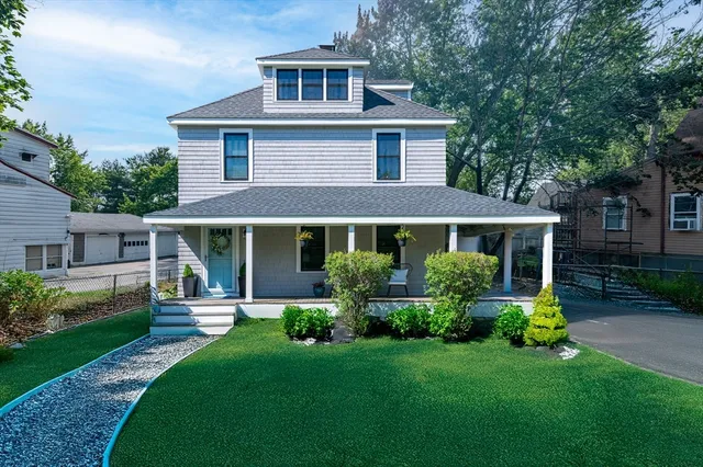 front view of a house with a yard