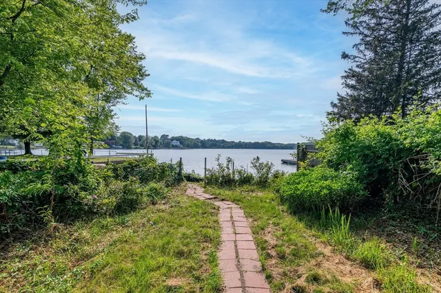 a view of a lake with a yard
