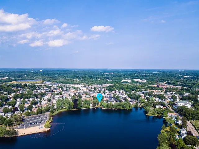 an aerial view of city and lake