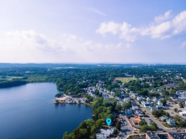 an aerial view of city and lake view