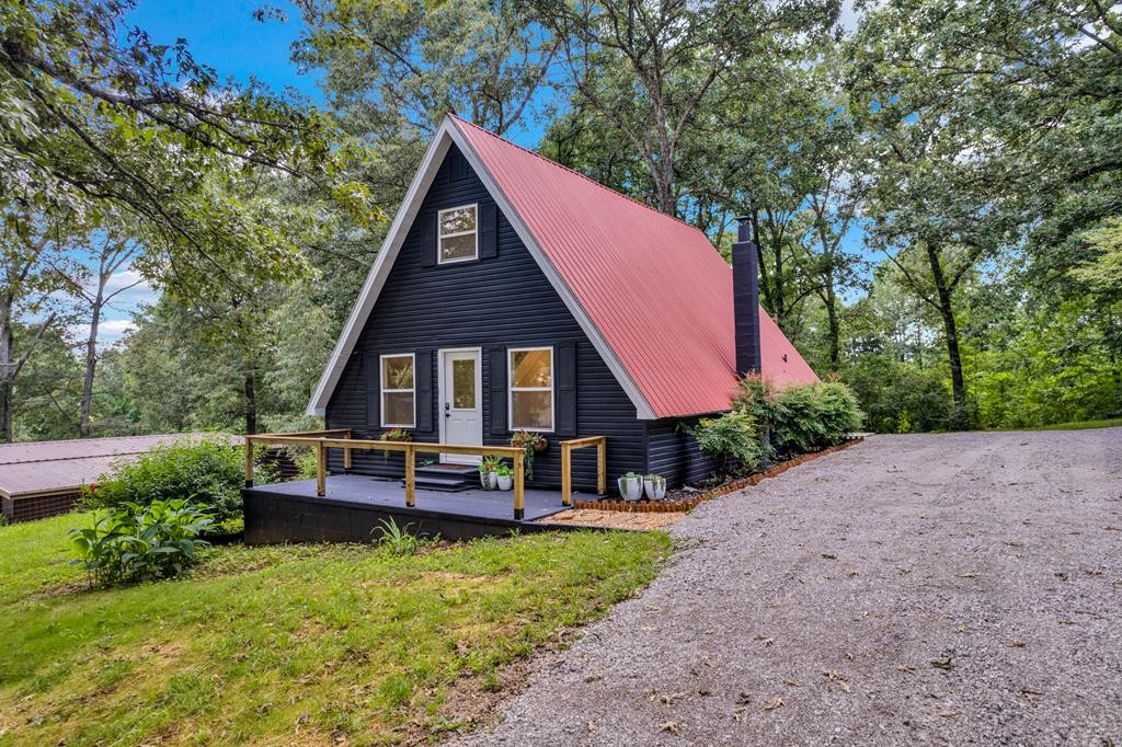 152 Parker Road Sparta, TN 38583 - Photo 1 of 30 a view of a house with a yard and sitting area