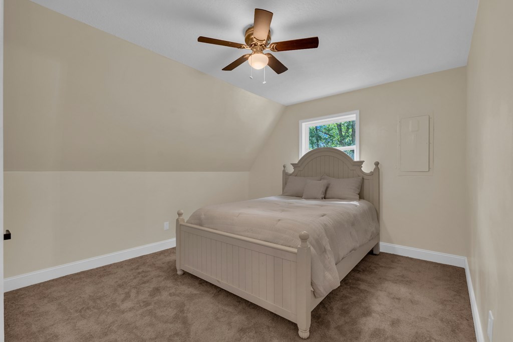152 Parker Road Sparta, TN 38583 - Photo 12 of 30 a bedroom with a bed and a ceiling fan