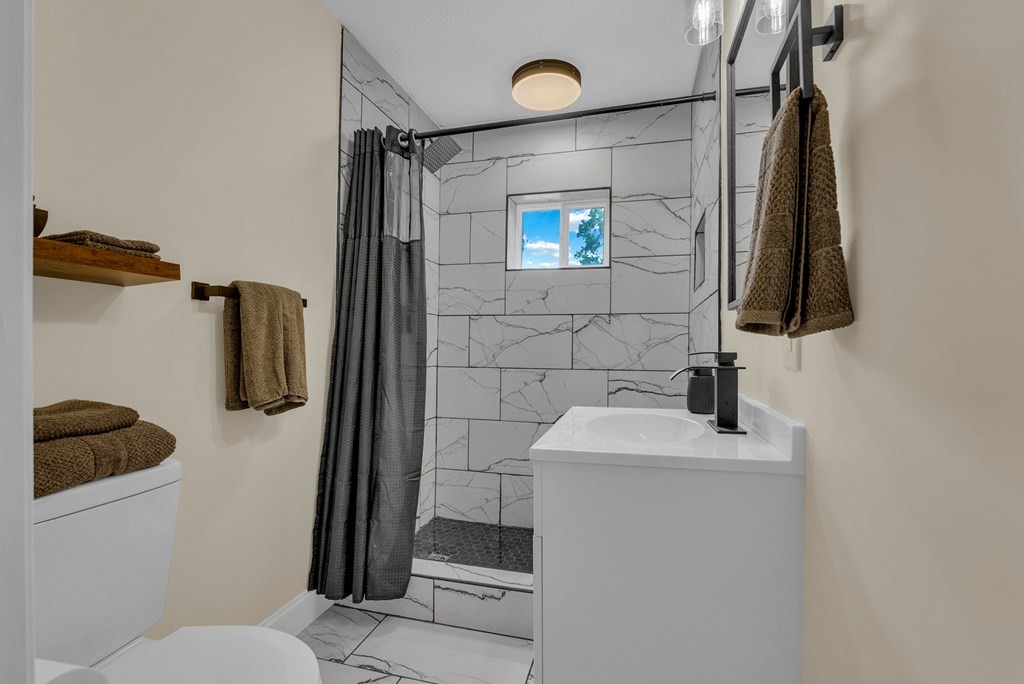 152 Parker Road Sparta, TN 38583 - Photo 17 of 30 a bathroom with a sink toilet and shower