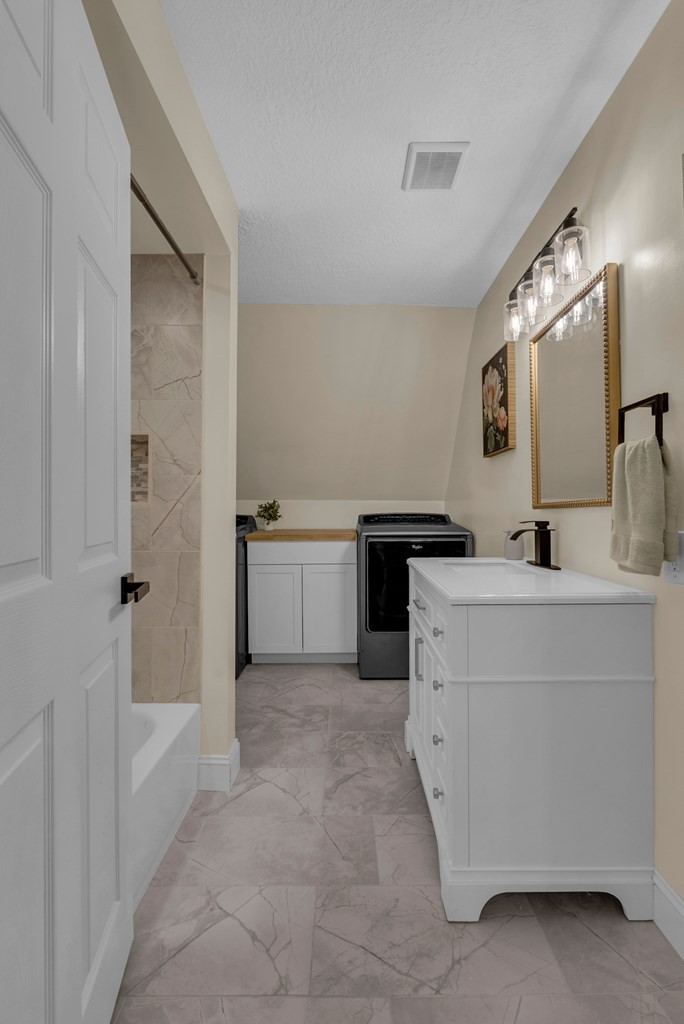 152 Parker Road Sparta, TN 38583 - Photo 9 of 30 a bathroom with a sink vanity and mirror