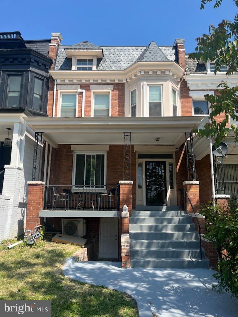 1113 Clifton Street Northwest Washington, DC 20009 - Photo 1 of 44 a front view of a house