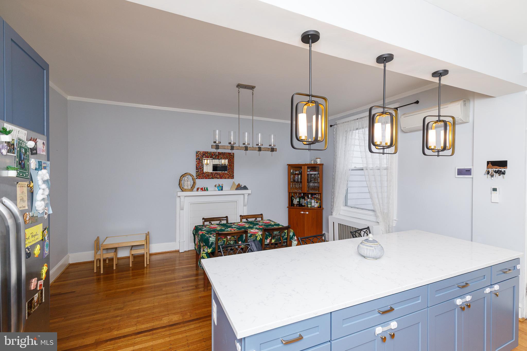 1113 Clifton Street Northwest Washington, DC 20009 - Photo 11 of 44 a view of a center kitchen island furniture and windows