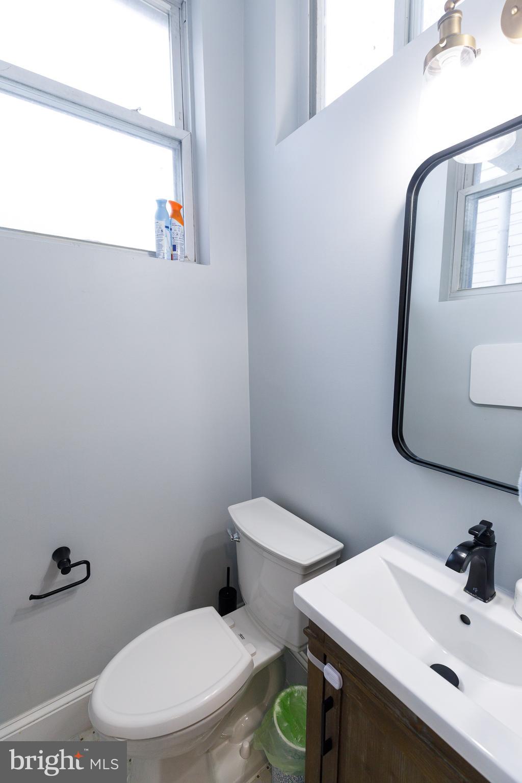 1113 Clifton Street Northwest Washington, DC 20009 - Photo 17 of 44 a white toilet sitting next to a bathroom sink