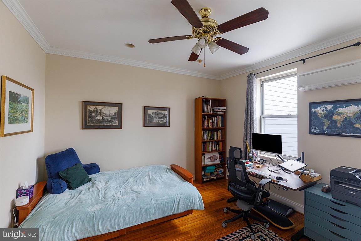 1113 Clifton Street Northwest Washington, DC 20009 - Photo 18 of 44 a bedroom with a workspace