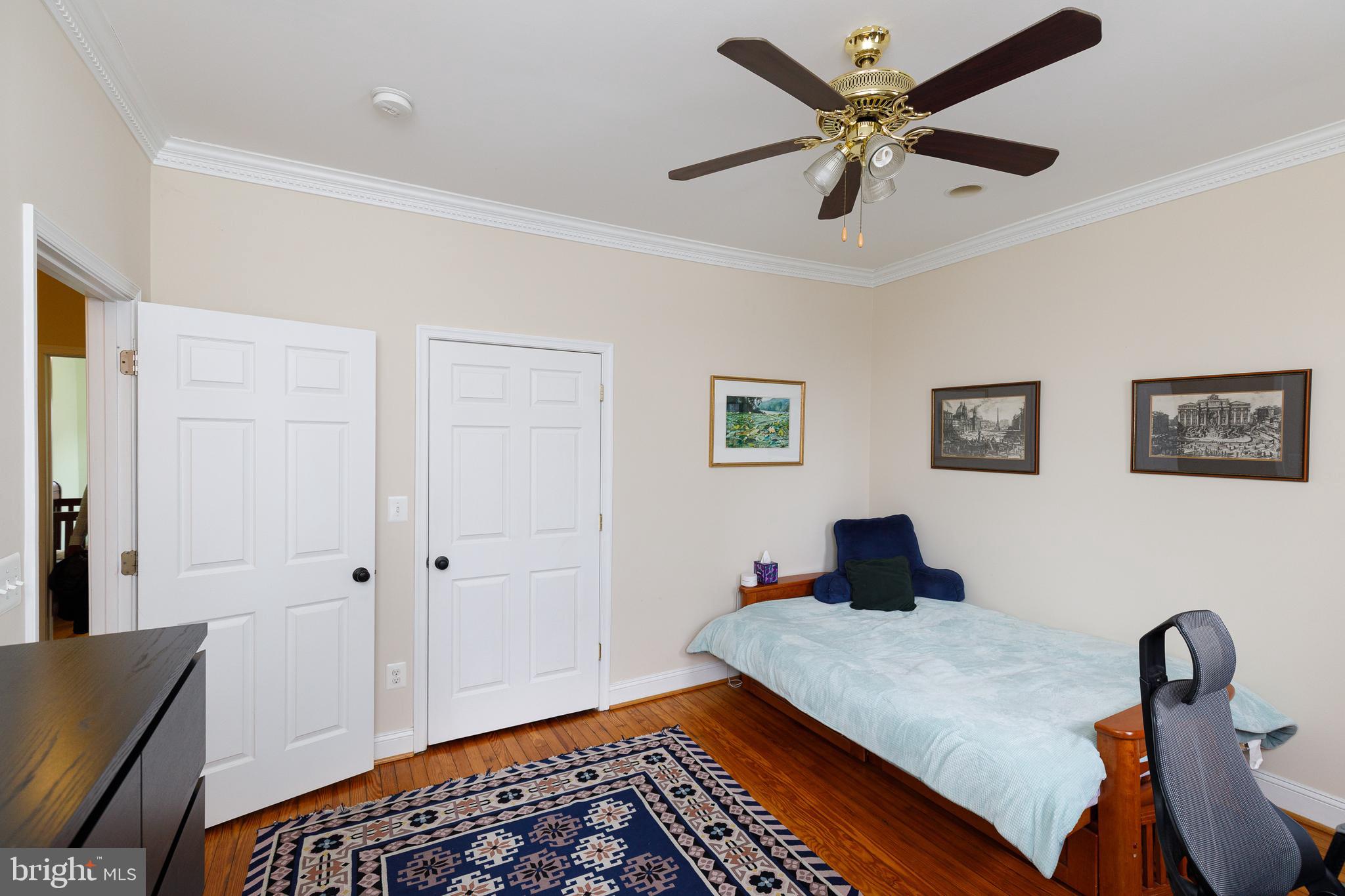 1113 Clifton Street Northwest Washington, DC 20009 - Photo 19 of 44 a bedroom with bed and a window