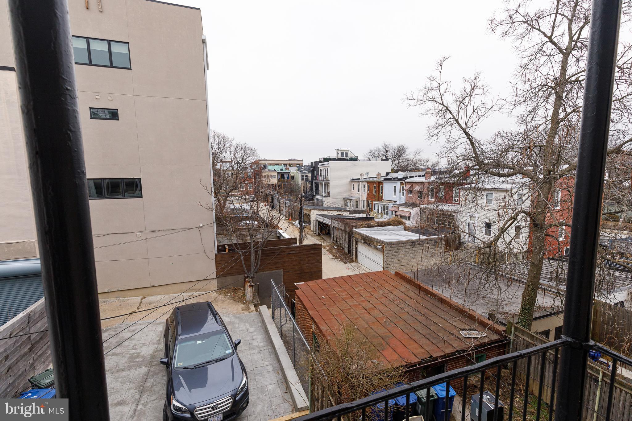 1113 Clifton Street Northwest Washington, DC 20009 - Photo 22 of 44 a view of roof deck with dining table and chairs with wooden floor and fence