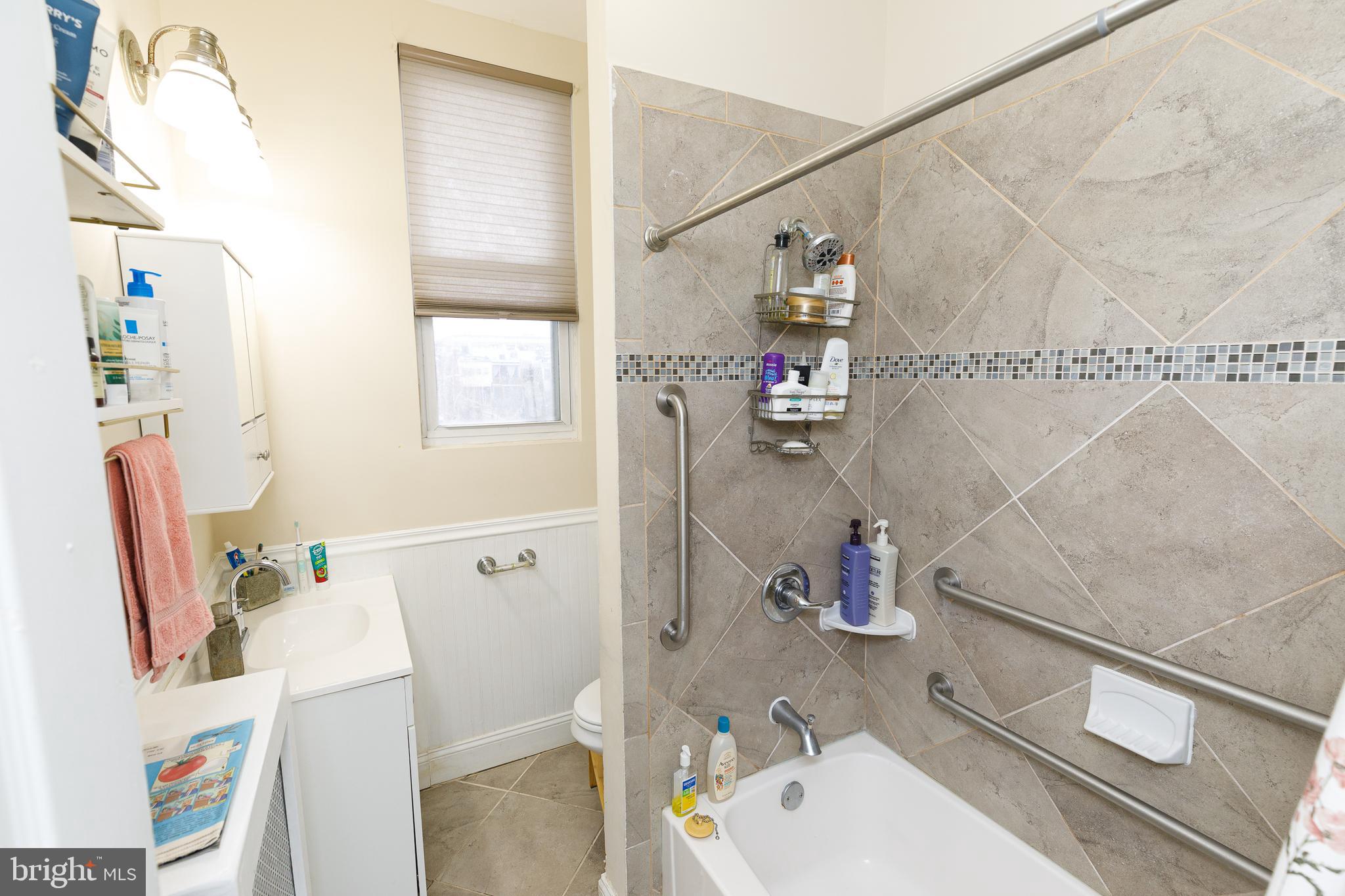 1113 Clifton Street Northwest Washington, DC 20009 - Photo 31 of 44 a bathroom with a sink toilet and shower