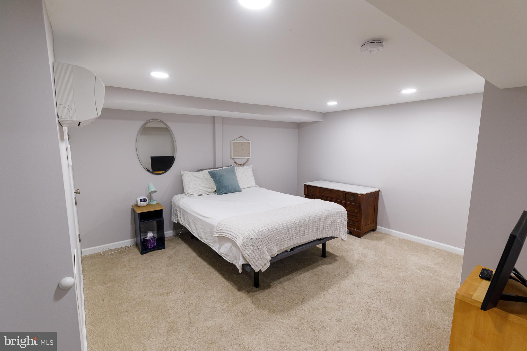 1113 Clifton Street Northwest Washington, DC 20009 - Photo 33 of 44 a bedroom with a bed and a view of bathroom