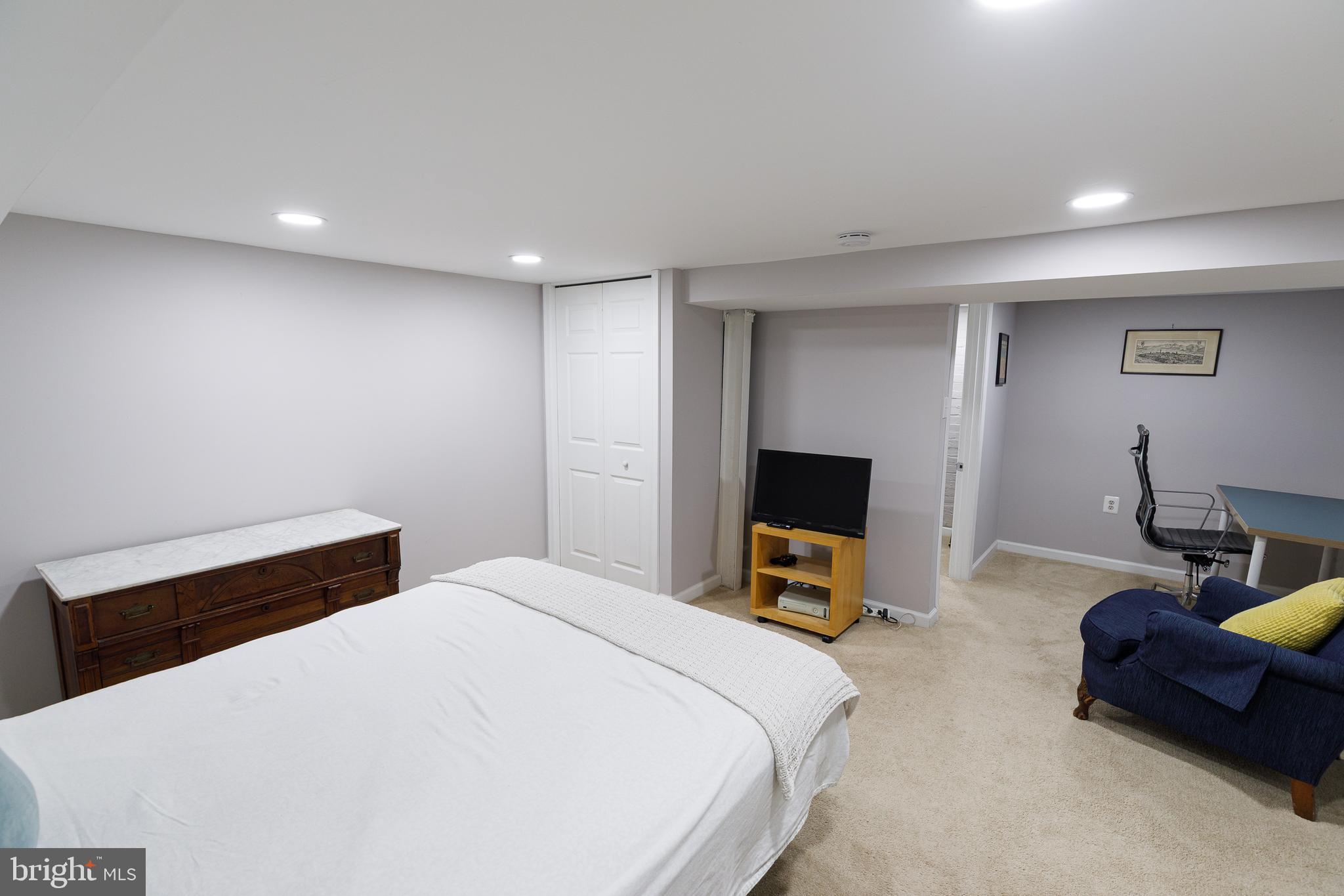 1113 Clifton Street Northwest Washington, DC 20009 - Photo 35 of 44 a bedroom with a bed and a couch