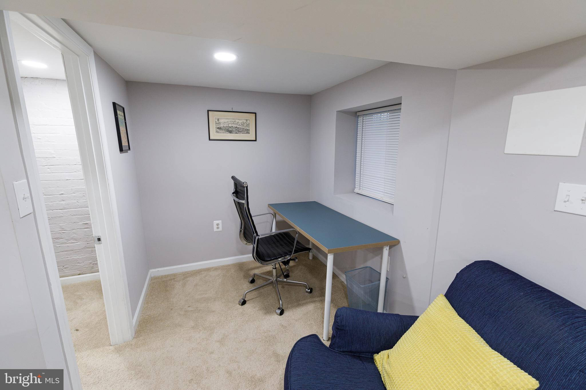 1113 Clifton Street Northwest Washington, DC 20009 - Photo 37 of 44 a workspace with furniture and wooden floor