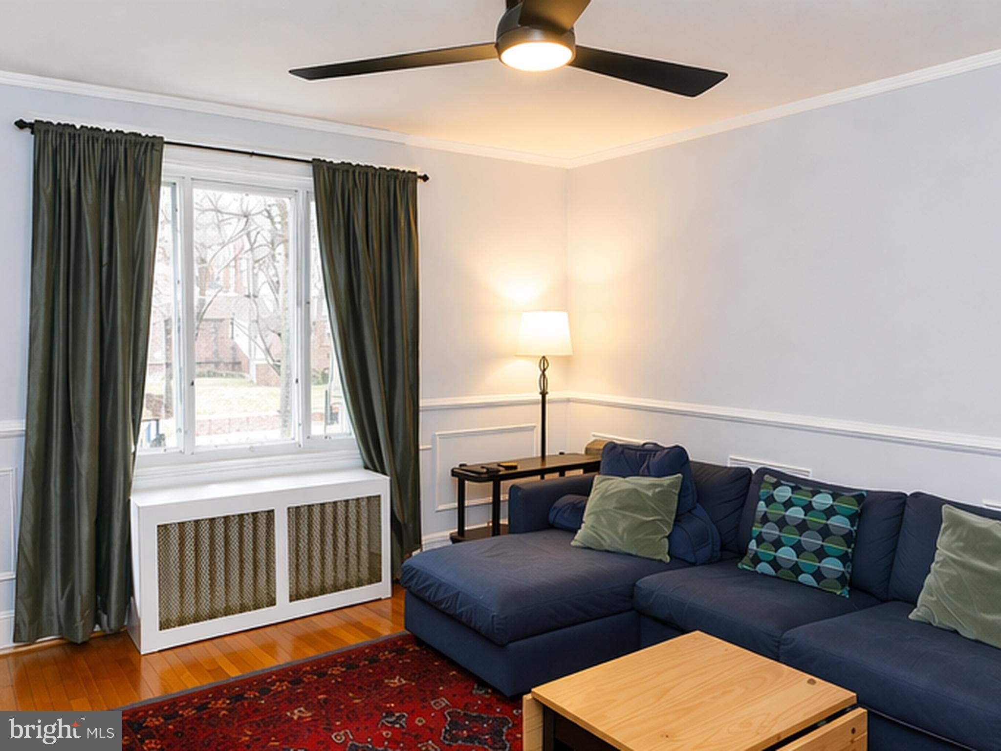 1113 Clifton Street Northwest Washington, DC 20009 - Photo 6 of 44 a living room with furniture and a window