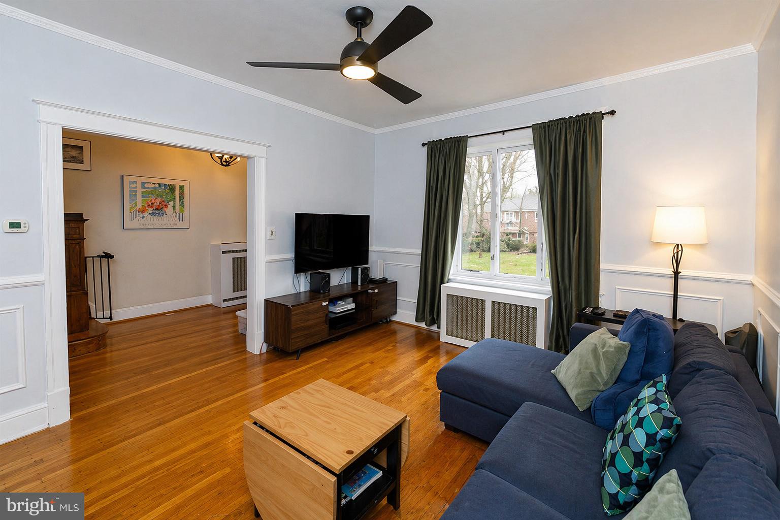 1113 Clifton Street Northwest Washington, DC 20009 - Photo 7 of 44 a living room with furniture and a flat screen tv