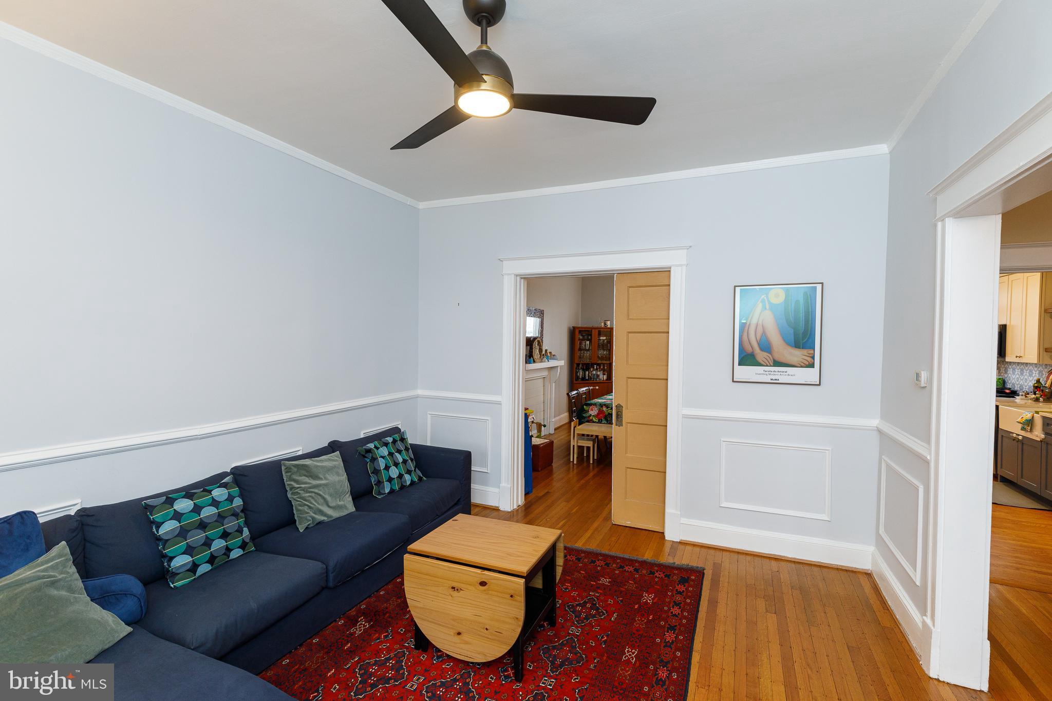 1113 Clifton Street Northwest Washington, DC 20009 - Photo 8 of 44 a living room with furniture and a wooden floor
