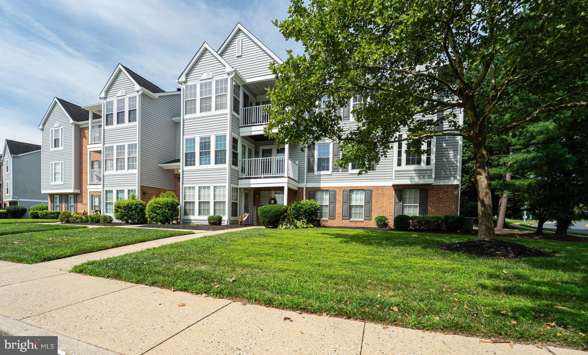 16 Laurel Path Court, Unit 1 Baltimore, MD 21236 - Photo 2 of 28 front view of a house with a yard