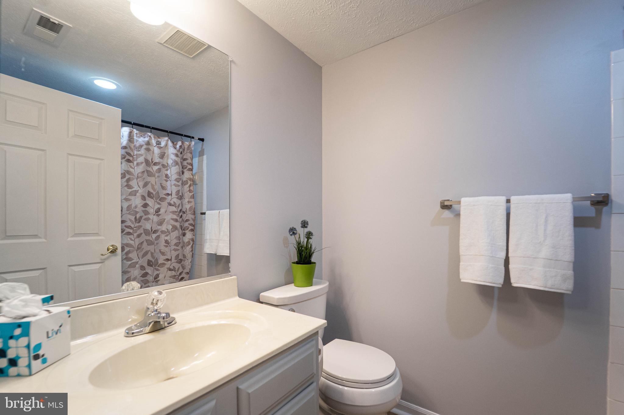 16 Laurel Path Court, Unit 1 Baltimore, MD 21236 - Photo 21 of 28 a bathroom with a sink toilet and shower