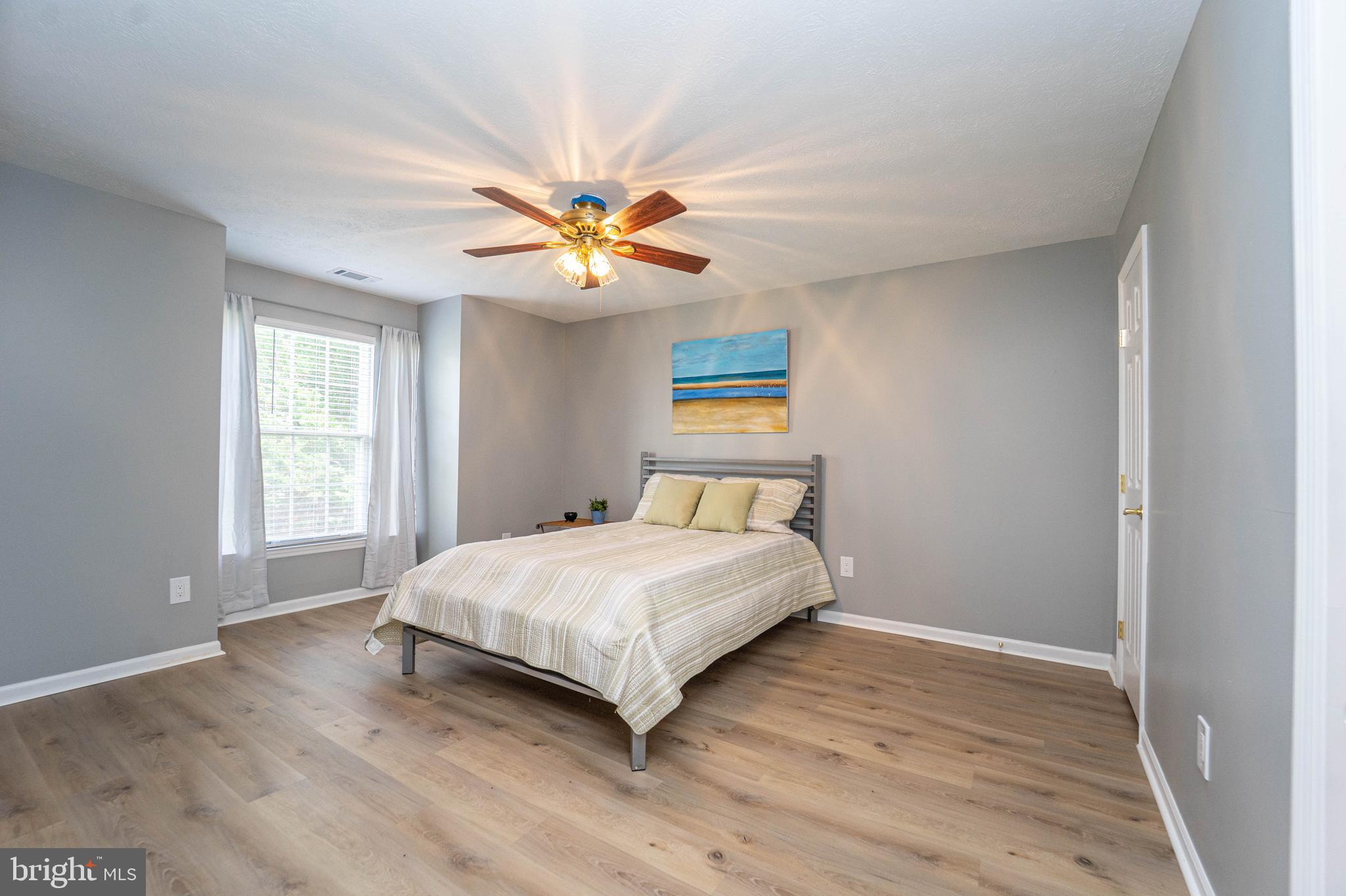 16 Laurel Path Court, Unit 1 Baltimore, MD 21236 - Photo 22 of 28 a bedroom with a bed and a window