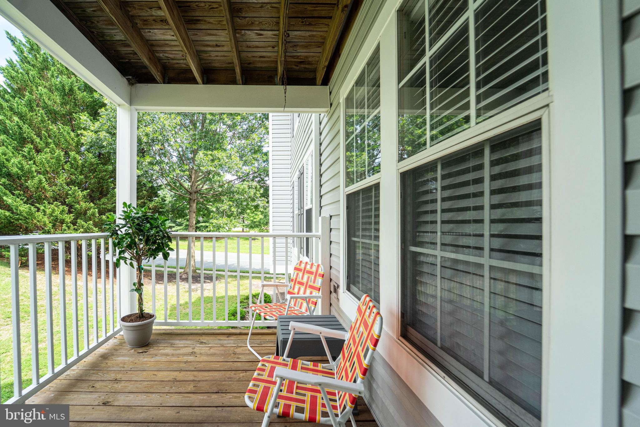 16 Laurel Path Court, Unit 1 Baltimore, MD 21236 - Photo 27 of 28 a balcony of a house with wooden floor and outdoor space