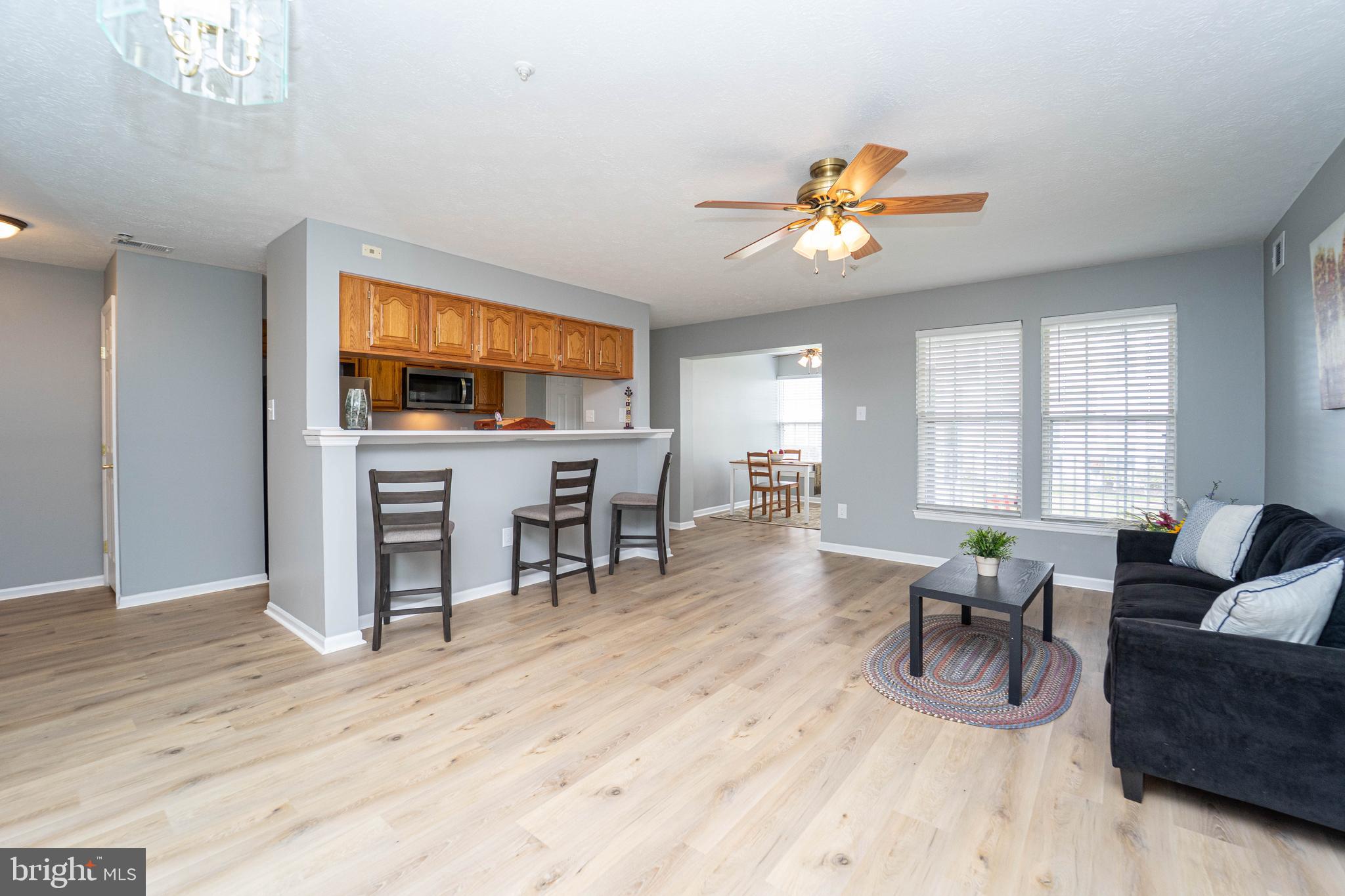 16 Laurel Path Court, Unit 1 Baltimore, MD 21236 - Photo 5 of 28 a living room with furniture a dining table and a window